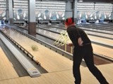One of the young people bowling