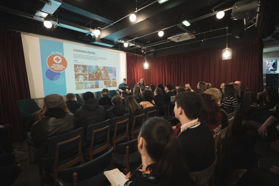 A picture of the audience watching the presentation