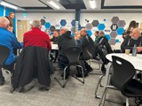 Elderly people taking part in the cyber security talk 