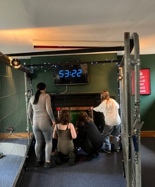 Young people figuring out how to escape the locked room