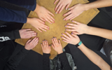 Youth group having a manicure - their hands are looking lovely round the table