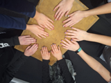 Youth group having a manicure - their hands are looking lovely round the table