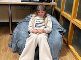 Young person sat on bean bag