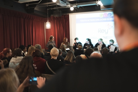 Young people talking about their projects to the room