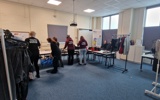 The group sorting out old clothes for their environmental project