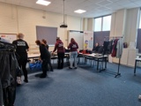 The Key+ group sorting out old clothes for their environmental project