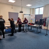 The Key+ group sorting out old clothes for their environmental project
