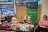 The group running their farmers' market stall