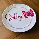 Pottery painted plate with Dolly Parton design