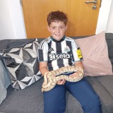 Young person holding a snake