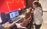 The KEY+ group looking on the internet and booking the escape room activity 
