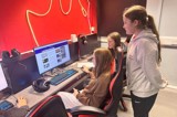 The Key+ group looking on the internet and booking the escape room activity 