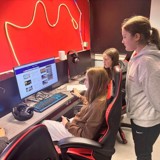 The Key+ group looking on the internet and booking the escape room activity 