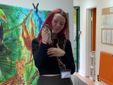 Young person holding a snake